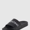 Valentino Slides Mit Label-Detail Modell 'XENIA' - Schwarz -Damenbekleidungsgeschäft 64p46eaeap738kag90rkocqcah74ql2gap33gjieaha34hhk61156hai6kqk8e2a8gplccppagpl2k9pa53j0c1kcpijgdhmcor66d9kc4rjaeb3ccrm4d3474s36c9m6sp3eoo