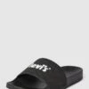 Levi’s® Acc. Slides Mit Label-Print Modell 'JUNE' - Schwarz -Damenbekleidungsgeschäft 9d73ic2l9gs32h9oal832ihj717kekpk8t658ihl893l4haf94o48giial632c2ja8q5ch2288rk8kak6go38e9h6oqj6e34cgq3ae1k6sr6ae1g6li36e1k70rjeor571i34c8
