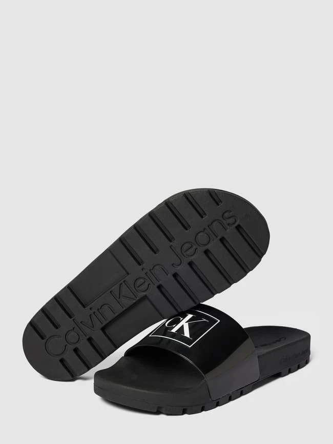 Calvin Klein Underwear Slides Mit Logo-Print Modell 'TRUCK' - Schwarz 6 Calvin Klein Underwear Slides Mit Logo-Print Modell 'TRUCK' - Schwarz – Bild 4